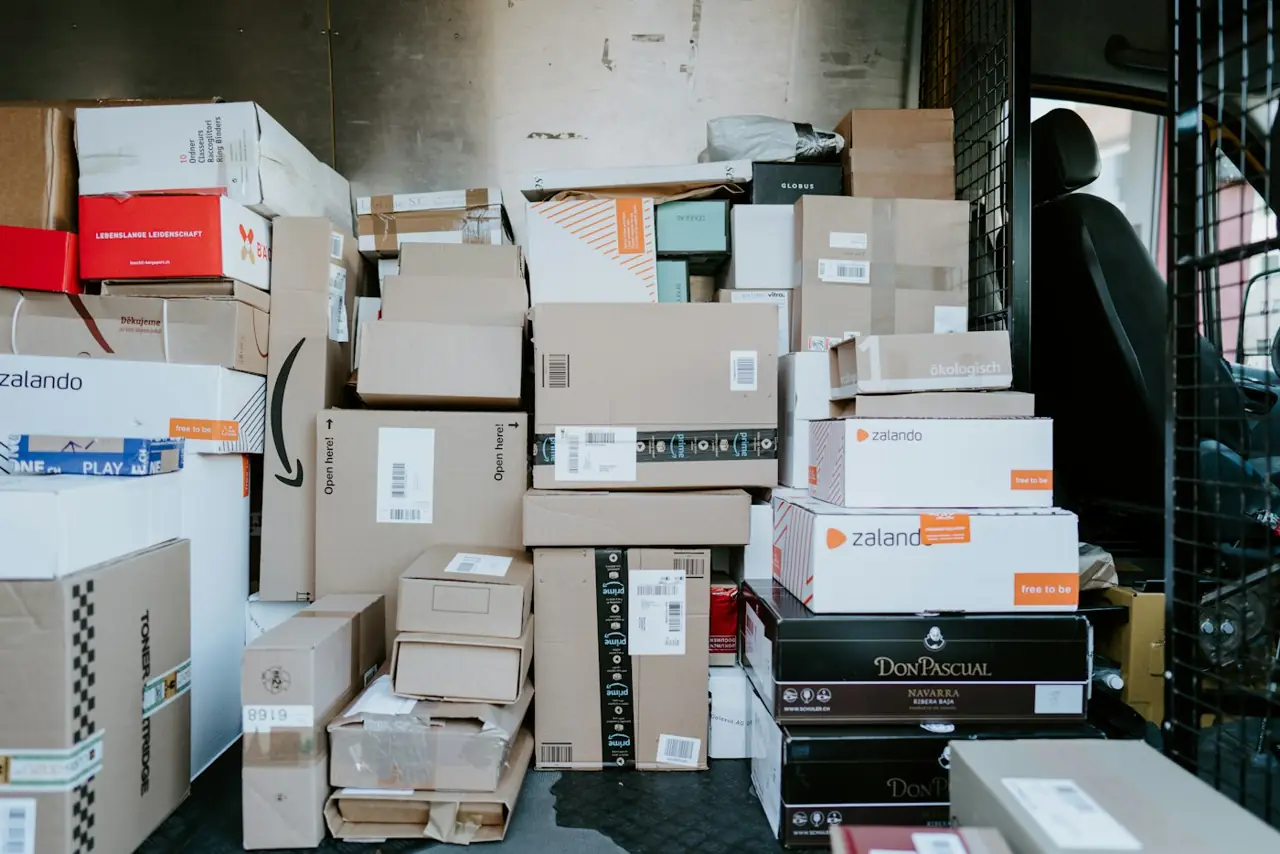 Packed parcels and boxes stacked in a stockroom, ready to ship